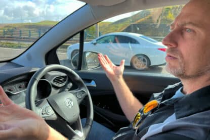 Aaron Schmidt on the "wrong side" of the car in the UK.