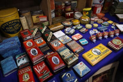 Antique tobacco tins for sale at the Chicagoland Antique advertising show.