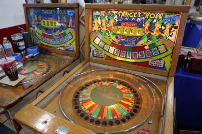 Vintage Bally Target Roll arcade game with colorful backglass and numbered scoring wheel.