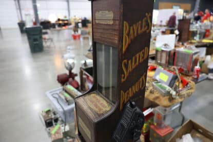 Antique Bayle’s Salted Peanuts vending machine with original lettering and cast iron coin crank.
