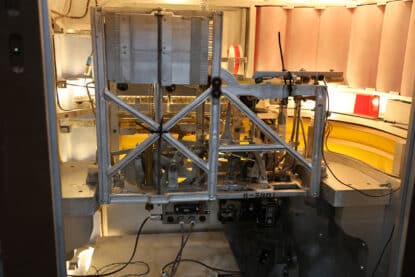 Interior view of a Gabel Kuro jukebox showcasing the selector arm, gear assembly, and rotating carousel mechanism.