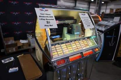 1954 Seeburg HF100R jukebox upgraded with Bluetooth audio and original vinyl playback, fully restored and ready to play.
