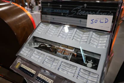 Seeburg Stereophonic jukebox with chrome accents and musical art deco design, marked as sold at vintage showcase.