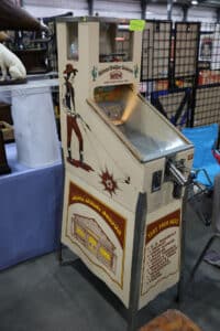 Silver Dollar Saloon skill game with Wild West graphics and coin-operated shooting challenge mechanism.