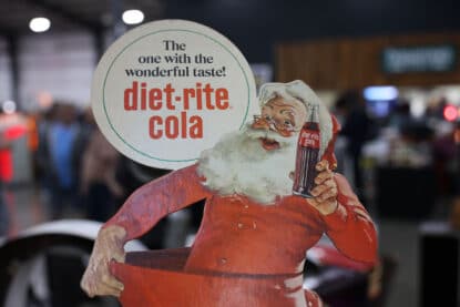 Vintage Santa Claus cardboard standee holding a bottle of Diet-Rite Cola with the slogan “The one with the wonderful taste!” displayed at the Chicagoland Coin-Op Show.