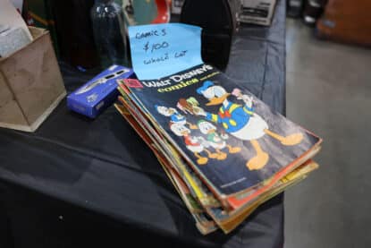 Stack of vintage Walt Disney comic books with Donald Duck comic on top for $100.