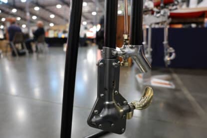 Close-up of a restored vintage Mercury outboard motor propeller.