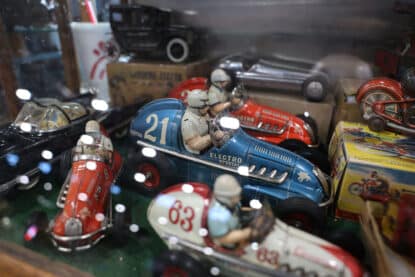 Vintage tin race cars toy display.