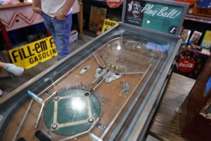 1934 Rockola World's Series baseball-themed antique pinball game titled Play Ball with a wooden playfield and mechanical scoring components.